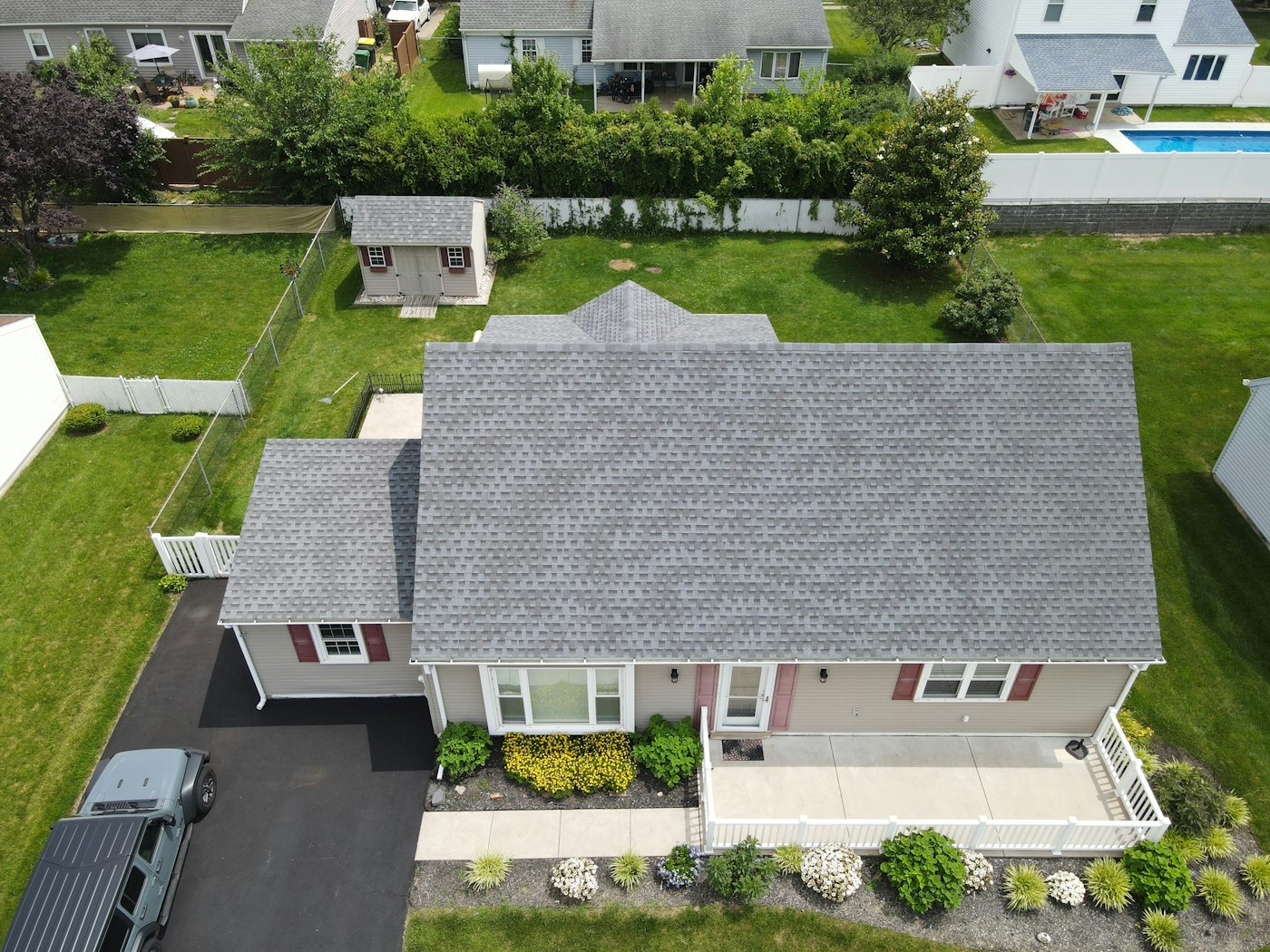 Suburban home with a completed shingle roof
